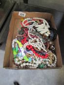 A tray of necklaces and bracelets