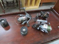 3 fishing reels and 2 spare spools