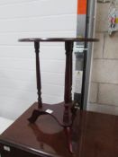 A mahogany effect wine table