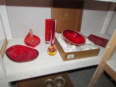 A quantity of red glass items