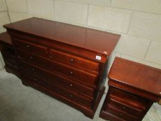 A modern 2 over 3 chest of drawers and pair of matching bedsides