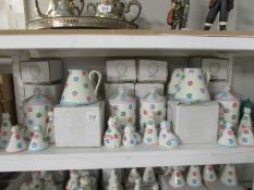 A shelf of 'Spotty Dotty Cat' cookie jars, jug,