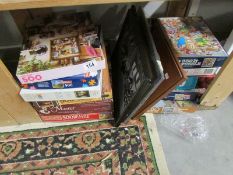 A quantity of pictures and jigsaw puzzles