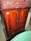 A mahogany effect TV cabinet