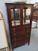 A mahogany music cabinet