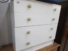 A white 4 drawer chest