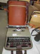 A portable typewriter and a pic nic set