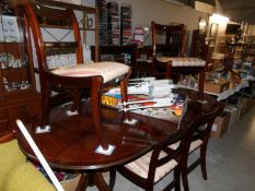 An extending dining table and 4 chairs