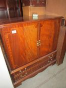 A mahogany effect TV cabinet