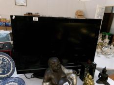 A Digihome 32" flat screen TV with remote,