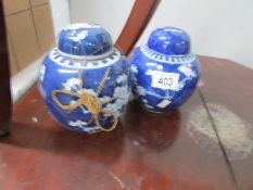 A pair of blue and white ginger jars