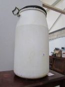 A vintage plastic milk churn