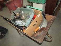 A wheel barrow and tools etc