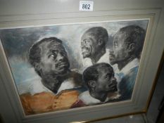 A framed and glazed print, study of 4 Afro/Caribean heads, signed J Chamberlain,