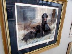 A framed and glazed limited edition print of black labradors, signed John Tricket,