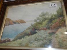 A framed and glazed watercolour coastal scene signed V Leach, 1933,