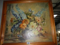 A pine framed oil on board floral arrangement signed Joyce Lakeman,