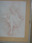 A framed and glazed crayon drawing entitled 'Seated model leaning on forward arm' signed Joseph