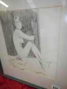 A framed and glazed pencil drawing of a nude,