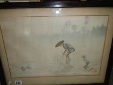 An Asian watercolour of a girl planting rice, signed and in original frame,