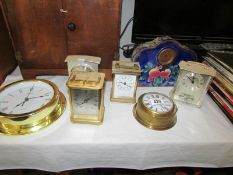 A quantity of clocks including 1930's porcelain mantel clock