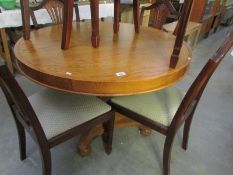 A good quality modern oak circular dining table