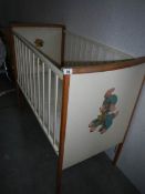 An old transfer printed babies cot