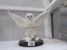 A resin ornament of a snowy owl