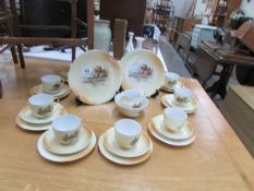 An Edwardian cottage scene tea set