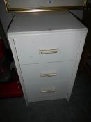 A white 3 drawer chest