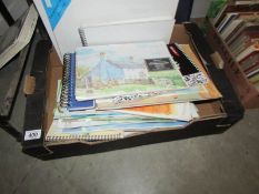 A box of artist material's including paintings