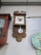 An oak effect kitchen wall clock