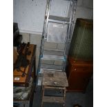 2 aluminium step ladders and a wooden step ladder