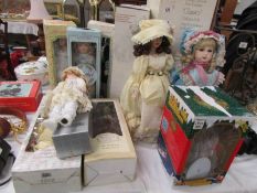 A quantity of boxed porcelain dolls including Marie Osmond classic doll