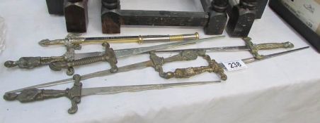 Quantity of sword styled letter openers