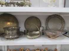 A shelf of silver plate items inc.