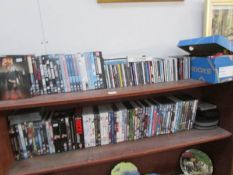 2 shelves of dvds & cds