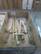 A box of ornamental dagger/letter openers