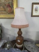 A large wooden table lamp