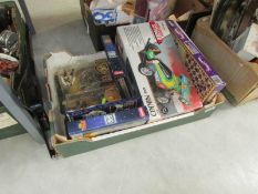 A box of toys including remote control car,