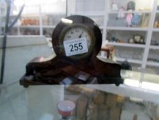 A small mahogany mantle clock