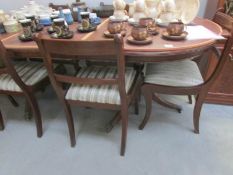 A dining table and 6 chairs