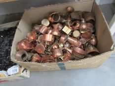 Large quantity of small copper ornaments inc. kettles, watering cans etc.