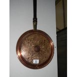 A copper warming pan