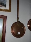 A copper warming pan