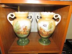 A pair of handled vases