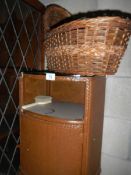 A old bedside cabinet and a wicker crib