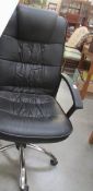 A black swivel office chair