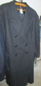 A large grey/black overcoat