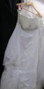 A 'Forever Yours' ivory bridal gown with gathered bodice and bead/sequin trim,